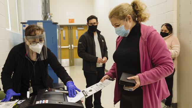 A woman casts her vote early in Chicago, Illinois, last month. Picture: Angus Mordant