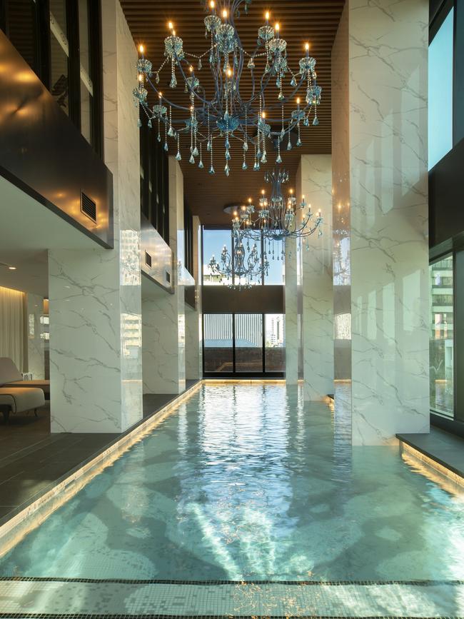 The pool at Sofitel Adelaide has chandeliers hanging overhead..