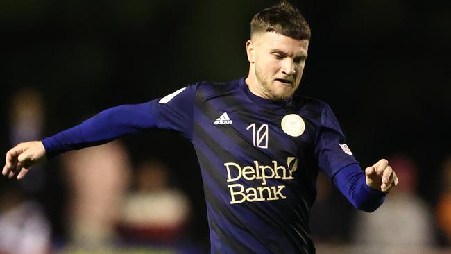 MELBOURNE, AUSTRALIA - AUGUST 31: Joe Guest of the Oakleigh Cannons runs with the ball during the Australia Cup Quarter Final match between Oakleigh Cannons FC and Sydney FC at Jack Edwards Reserve, on August 31, 2022 in Melbourne, Australia. (Photo by Robert Cianflone/Getty Images)