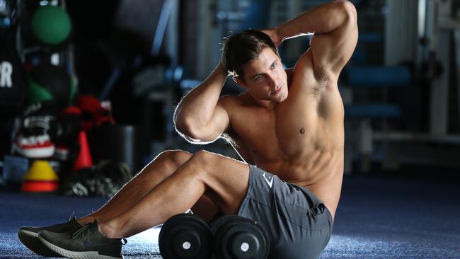 Former Titan Kayne Lawton is now an online trainer, writing nutrition plans for others via Instagram. Kayne Lawton working out at a Cudgen gym. Picture Glenn Hampson