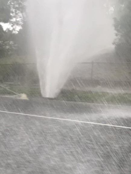 A burst water main outside Moggill State School. Another water main burst in Kangaroo Gully Rd, Bellbowrie.