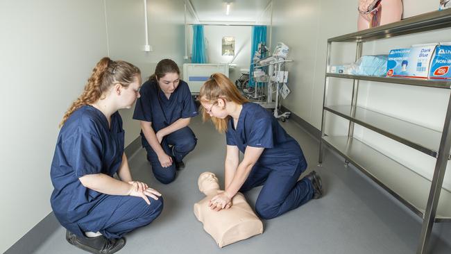 Runcorn State High School Health Academy. Year 12 students Teagan Currie, Sara-Jo Scott and Jayde McLennan train in the new remote intensive care unit. Thursday, October 8 2020. Picture: Renae Droop