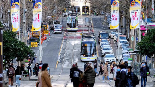 People are seen flooding the Melbourne CBD as the city appears to be ‘back in business’. Picture: Luis Ascui