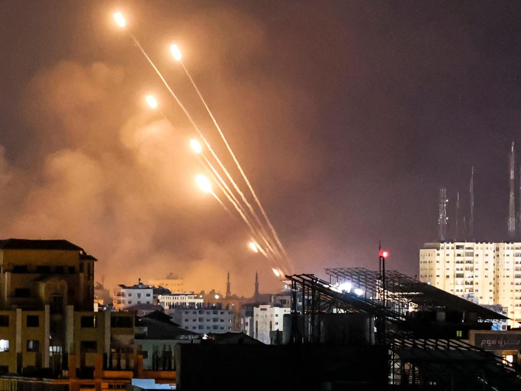 A salvo of rockets is fired by Palestinian militants from Gaza City toward Israel. Picture: MOHAMMED ABED/AFP