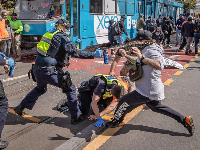 A protester lunges at police. Picture: Jason Edwards