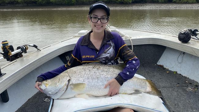 Taiya Kilcullen with her monster 1.06m barramundi caught in the Haughton River.