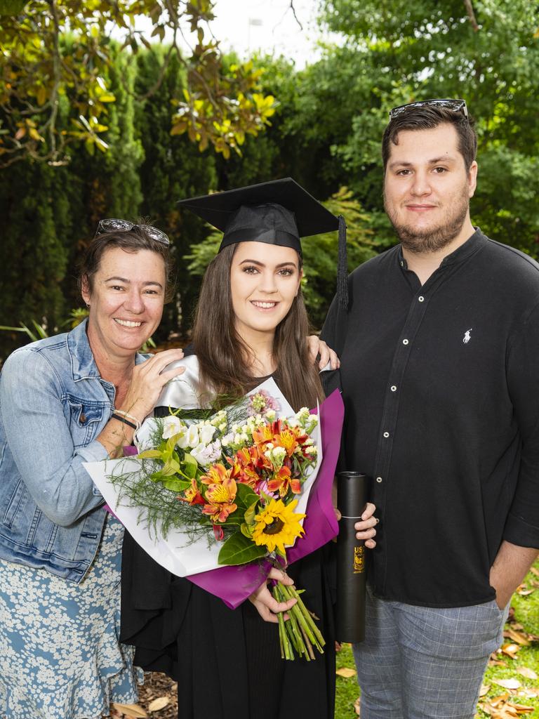 Bachelor of Business (Human Resource Management) graduate Chelsea Sawtell with Kerri Sawtell and Brayden Hughes at the UniSQ graduation ceremony at Empire Theatres, Tuesday, December 13, 2022. Picture: Kevin Farmer