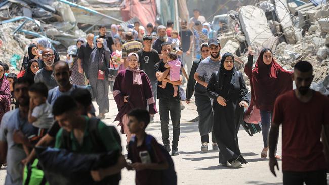 Residents flee the al-Bureij refugee camp amid an Israeli bombardment. Picture: AFP.