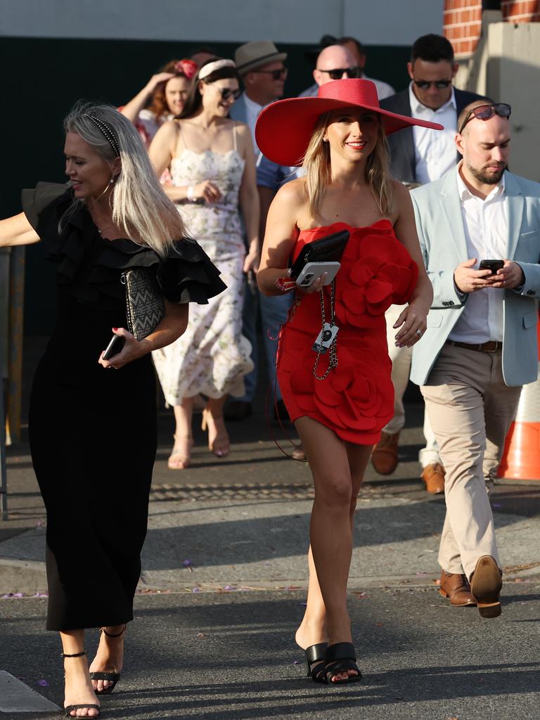 Punters leave Eagle Farm racecourse on Melbourne Cup Day.