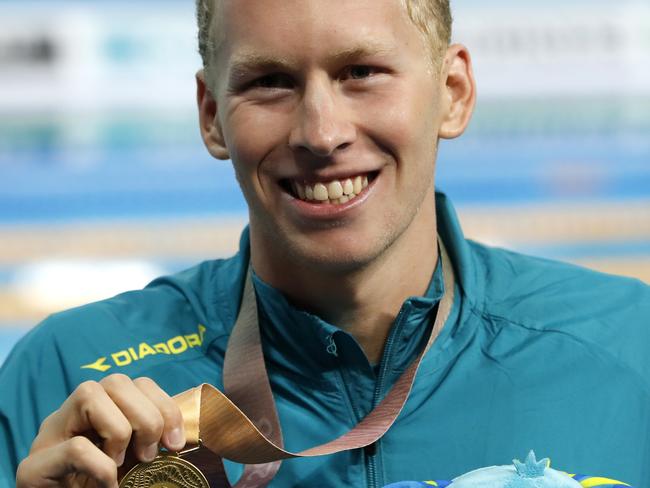 Men's 400m individual medley gold medal winner Australia's Clyde Lewis celebrates at the Aquatic Centre during the 2018 Commonwealth Games on the Gold Coast, Australia, Friday, April 6, 2018 (AP Photo/Mark Schiefelbein)