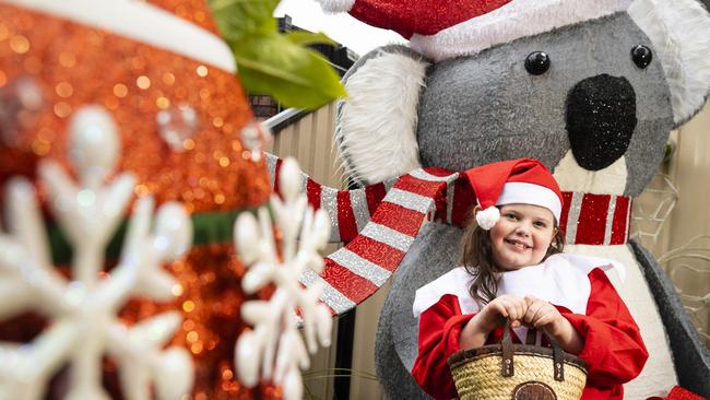 Isabella Botten is excited to show off the Christmas lights display her family has made at their Kearneys Spring home, Tuesday, November 30, 2021. Picture: Kevin Farmer