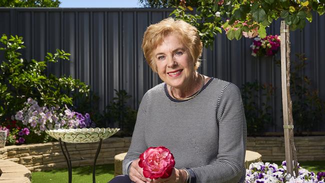 Sandy Mojsish with her roses at home in Royal Park, after winning best rose. Picture: Matt Loxton