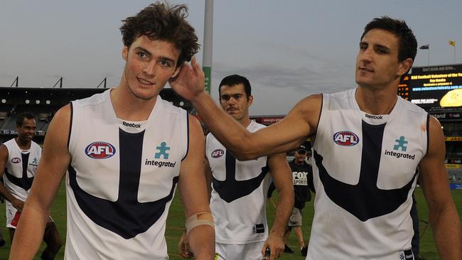 Dylan Roberton with Fremantle captain Matthew Pavlich after making his AFL debut in 2010.