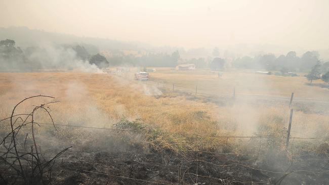 TFS crews conduct a controlled burn on Arve Road only 2km from Geeveston. Picture: RICHARD JUPE