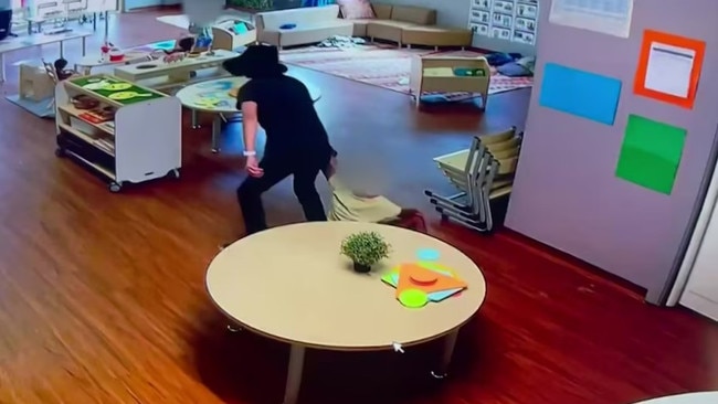 staff member aggressively yanking a child by the wrist. Picture: ABC