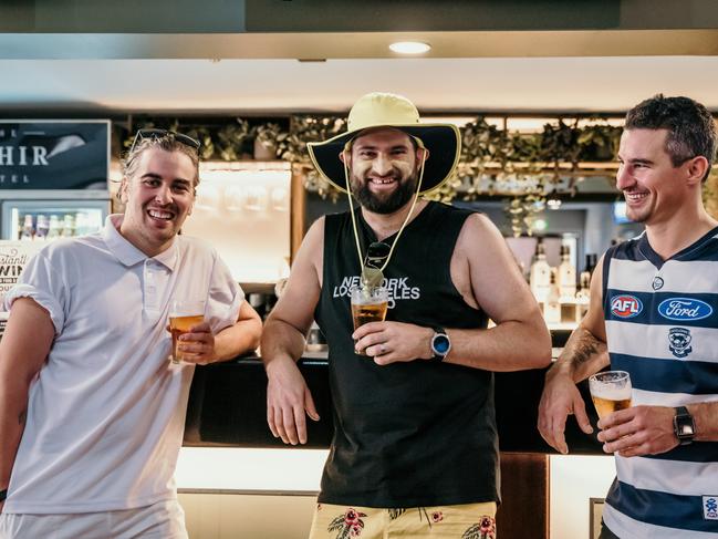 Australia Day in Orange, NSW. Jake Ruddy (man in white), Chris Long (in Geelong AFL gear) and Beau Baddock (in the hat) drinking beer at the Ophir. Picture: Emily Ellis