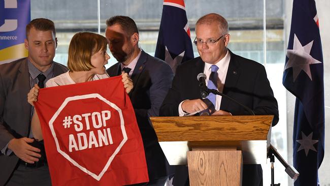 Scott Morrison was heckled by a climate change protester today. Picture: AAP Image/Dave Hunt
