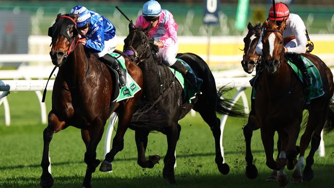 Adam Hyeronimus (blue silks) rides Storm The Ramparts to victory at Royal Randwick on Saturday. Picture: Jeremy Ng / Getty Images