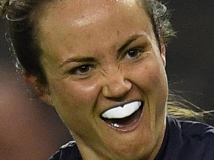 Daisy Pearce of Victoria (right) reacts after Victoria kicked a goal during the AFLW State of Origin match between Victoria and the Allies at Etihad Stadium in Melbourne, Saturday, September 2, 2017. (AAP Image/Julian Smith) NO ARCHIVING, EDITORIAL USE ONLY