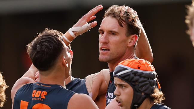 SYDNEY, AUSTRALIA - SEPTEMBER 07: Lachlan Keeffe of the Giants celebrates a goal with teammates during the 2024 AFL First Qualifying Final match between the Sydney Swans and the GWS GIANTS at The Sydney Cricket Ground on September 07, 2024 in Sydney, Australia. (Photo by Dylan Burns/AFL Photos via Getty Images)