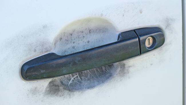 Cars along Western Beach Rd were fingerprinted as part of the investigation into the suspicious death on nearby Malone St. Picture: Mark Wilson