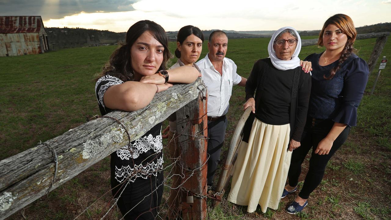 Yazidi genocide survivors L-R Nihad Alawsi 19, Baran Omar Ali 32, Khudeeda Omar Qoolo 50, Shami Said Shamo 66, Faha Biso Ali 22, together just outside Toowwoomba, QLD. Nihad (front) was taken hostage, sold as a child bride, had a son Isa (now 3) who has been taken from her and absorbed in to ISIS, but all are experiencing ongoing horrors from ISIS, with family members either being held hostage for ransom. Lyndon Mechielsen/The Australian