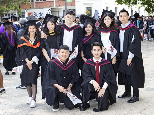 Jamy Gooi, Chi Chien Gooi, Kong Chewweng, Jia Jing Choy, Liwen Lew, Zhao Guo, Lihong Chew and Jiawei Tan at the UTAS Graduation at Launceston. PICTURE CHRIS KIDD