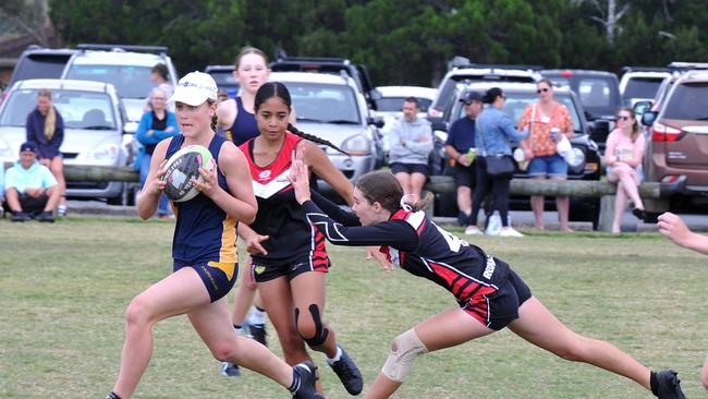 Maggie Walker slicing through a gap for Fairholme College.