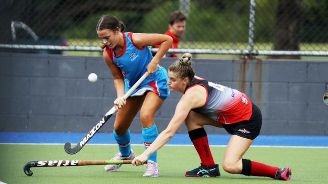 Cairns Hockey. Saints v Souths women on Rainforest Turf. Saints' Liv McArthur and Souths' Georgia Trompf. PICTURE: STEWART McLEAN