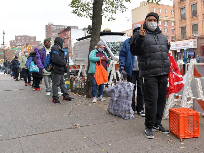 New Yorkers line up line for thanksgiving meals at a Manhattan Food Bank. Picture: Getty Images