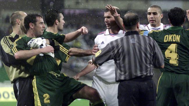 David Trezeguet (second from right) gets caught up in a scuffle with Australia’s Kevin Muscat (second from left) and international teammate Zinedine Zidane during a friendly match between the Socceroos and France at the MCG in 2001.