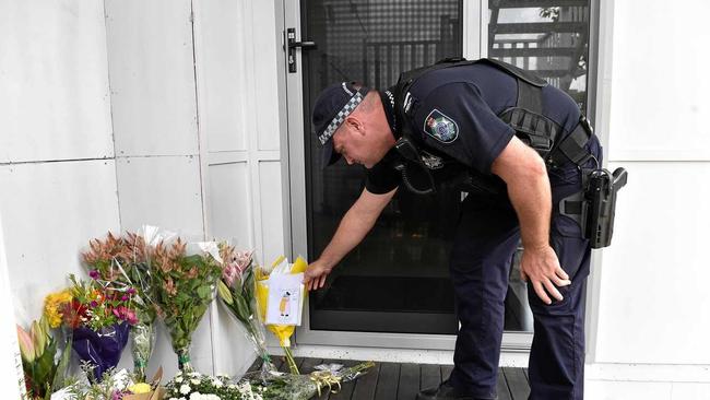 Senior constable Matt Clark reads messages of hope left at the Mosque of Sunshine Coast. Picture: Patrick Woods