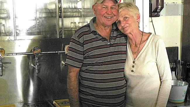 Publicans Bernie and Debbie Kerr serve their last drinks at the Linville Hotel after nearly 36 years in the business. Picture: Contributed