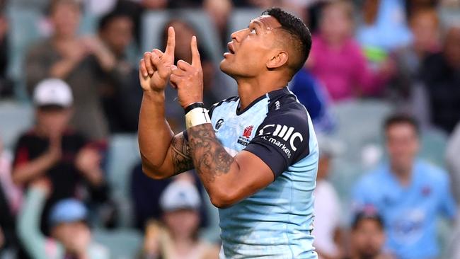 Israel Folau of the Waratahs celebrates scoring a try during the Round 13 Super Rugby match between the NSW Waratahs and the Melbourne Rebels at Allianz Stadium in Sydney, Sunday, May 21, 2017. (AAP Image/Paul Miller) NO ARCHIVING, EDITORIAL USE ONLY