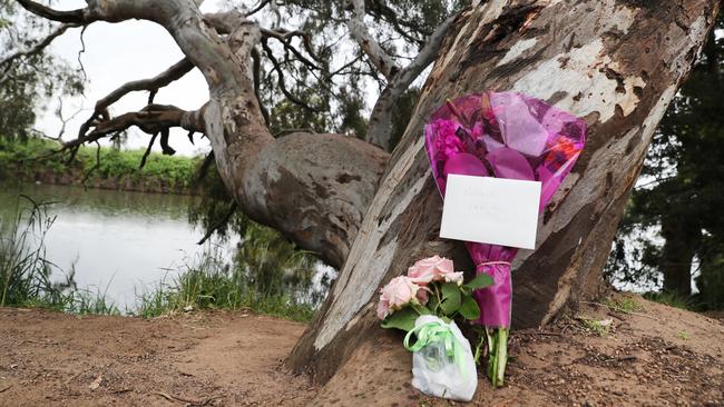 Flowers left by local residents at the scene of Kanady Moo’s drowning. Picture: David Crosling