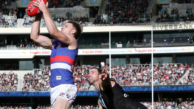 Jake Stringer marks in front of Matthew Broadbent. Picture: Sarah Reed.