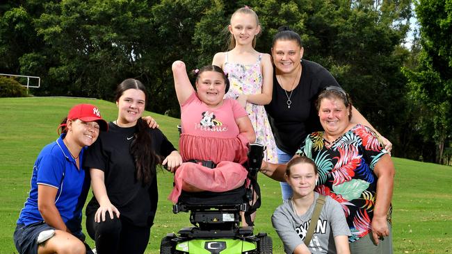 Hailey Collins, Sophie Collins, Shae-lea Collins, Bianca Collins, Chelsea Collins and Donna Collins with Aliannah Green-Collins who lost her limbs to meningococcal. Picture, John Gass.