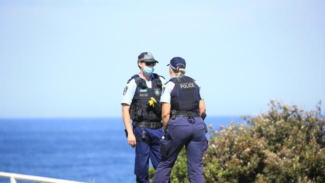 Police at the scene where Mr Papanakos fell off the cliff in Coogee. Picture: Christian Gilles