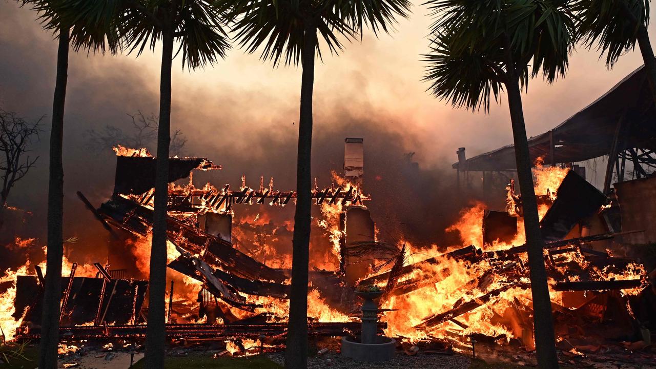 Homes have been engulfed in flames across the city. Picture: Agustin Paullier / AFP