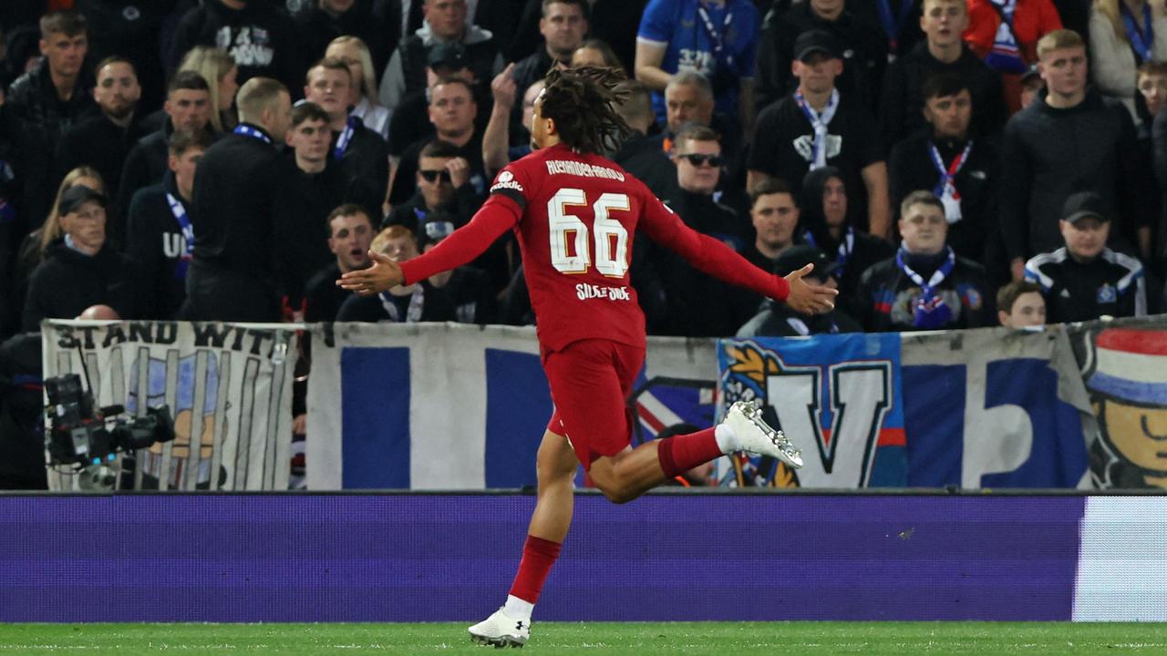 Liverpool's English defender Trent Alexander-Arnold (C) celebrates scoring his team's first goal from a free kick during UEFA Champions League group A football match between Liverpool and Glasgow Rangers at Anfield in Liverpool, north west England on October 4, 2022. (Photo by Nigel Roddis / AFP)