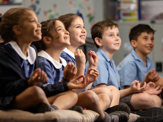 L-r  Gigi, 8, Sienna, 8, Mikaela, 8, Andy, 9 and Joshua, 9. St. John Bosco's Primary School has a program that teaches kids mindfulness to boost their mental health. Picture: Jason Edwards  St. John Bosco's Primary School has a program that teaches kids mindfulness to boost their mental health. Picture: Jason Edwards