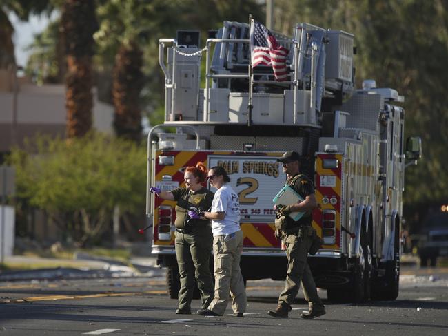 Investigators walk the on the scene of an explosion Saturday, May 17, 2025, in Palm Springs, California. Picture: AP Photo/Eric Thayer