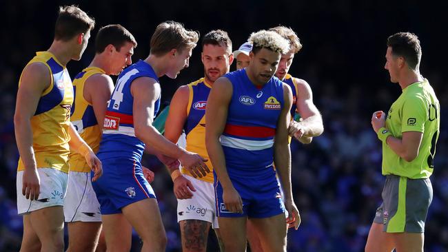 Eagles players rough up Jason Johannisen in Round 15. Picture: Michael Klein