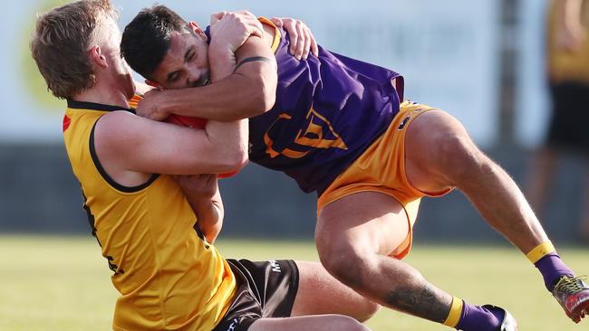 Ovens and Murray’s Jedd Longmire takes down Kyle Clarke from Goulburn Valley. Picture Yuri Kouzmin