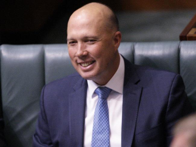 Home Affairs Minister Peter Dutton sits in Parliament House on Monday. Mr Dutton could strike immediately or wait until parliament returns on September 10 to challenge the PM. Picture: Rod McGuirk/AP