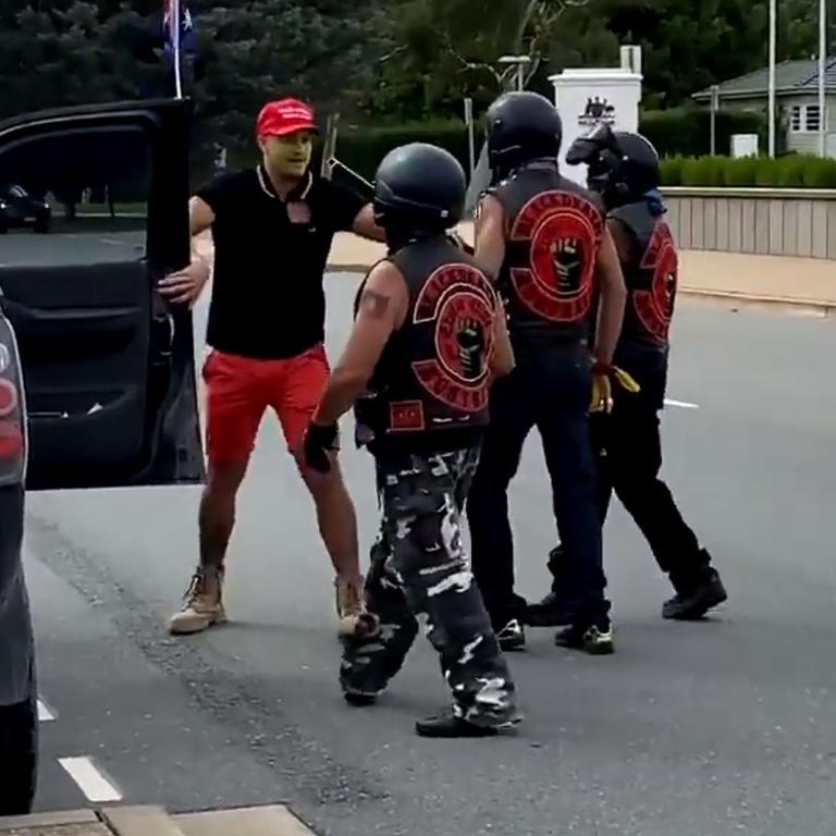 The man was wrestling with the trio over their Aboriginal flag. Picture: @hilarywardhaugh