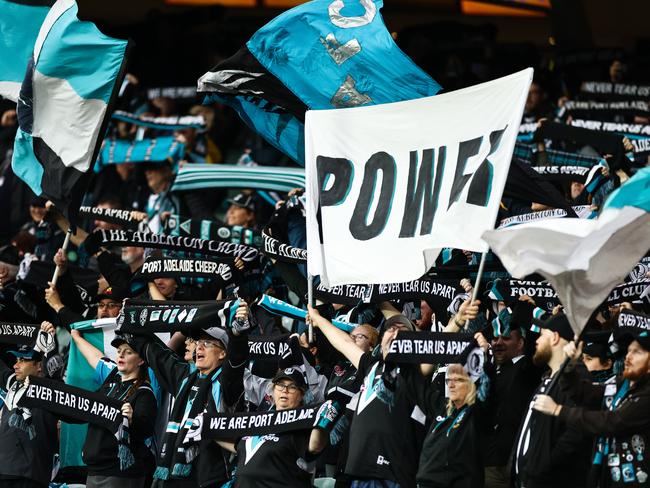 ADELAIDE, AUSTRALIA - SEPTEMBER 12: Port Adelaide Power fans celebrate during the round 17 AFL match between the Port Adelaide Power and the Essendon Bombers at Adelaide Oval on September 12, 2020 in Adelaide, Australia. (Photo by Daniel Kalisz/Getty Images)