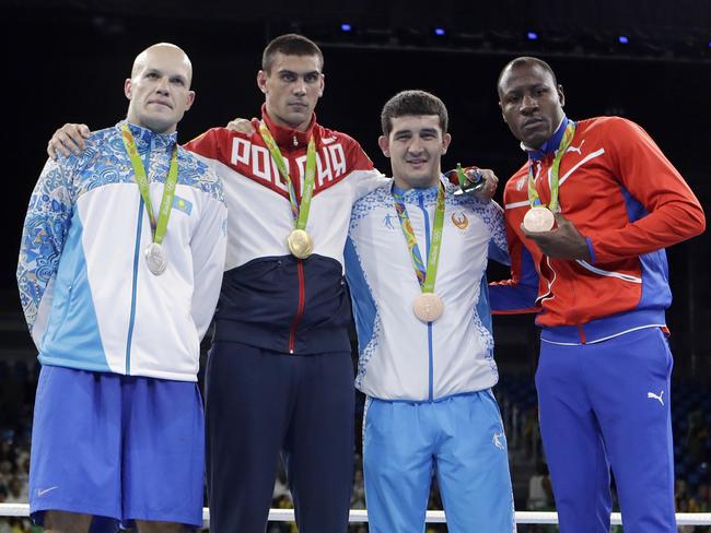 From left to right, Kazakhstan's Vassiliy Levit, silver; Russia's Evgeny Tishchenko, gold; Uzbekistan's Rustam Tulaganov, bronze; and Cuba's Erislandy Savon, bronze.