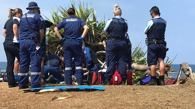 Emergency services at the scene at Lennox Head, where a tree has fallen on a man. Picture: Mitchell Craig