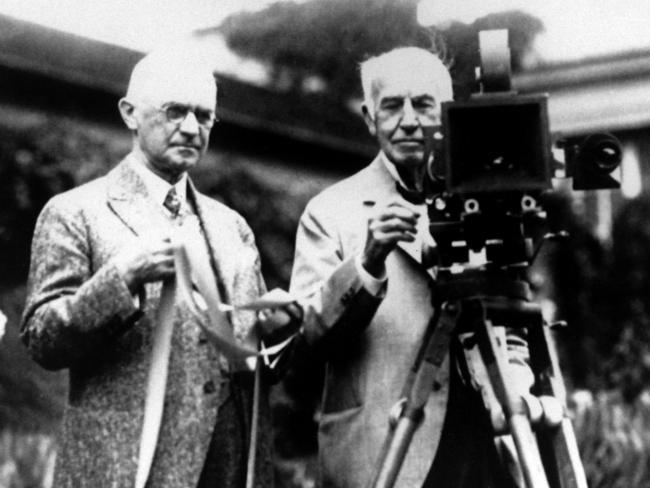 Kodak Company founder George Eastman (L) and Thomas Edison pose with their inventions in the 1920s.